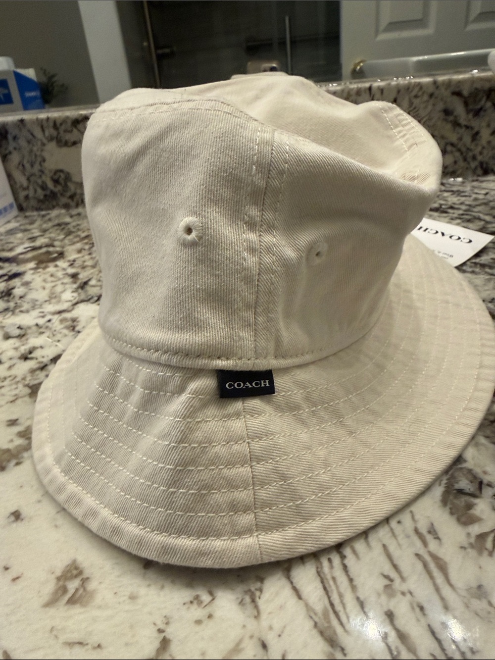 Coach ladies  ChalkCotton Bucket Hat with Logo Tab size M/L.. tags on ..authenti